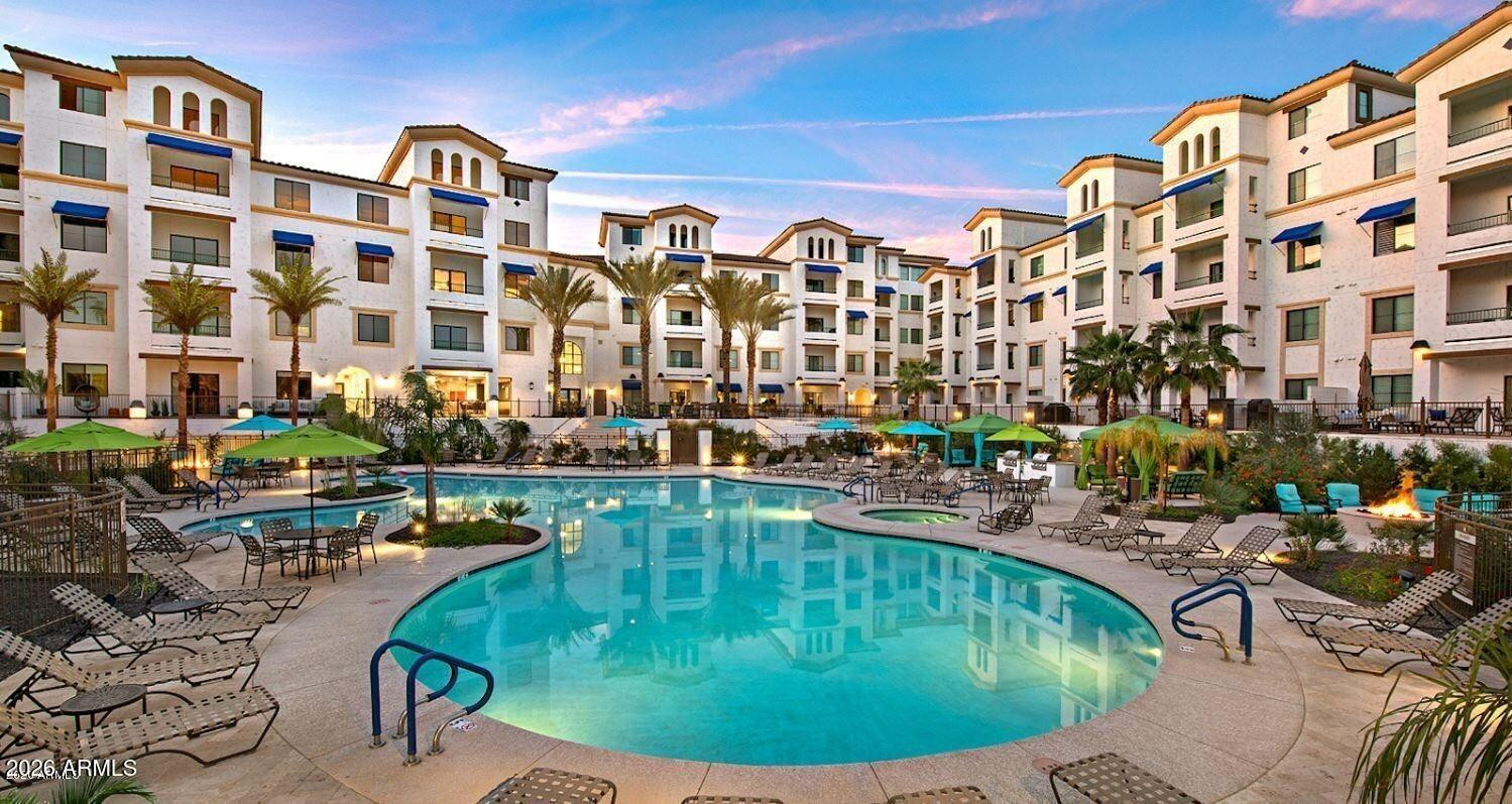 2511 West Queen Creek Road, Unit 438 Chandler, AZ 85248 - Photo 19 of 23 a view of swimming pool with outdoor seating