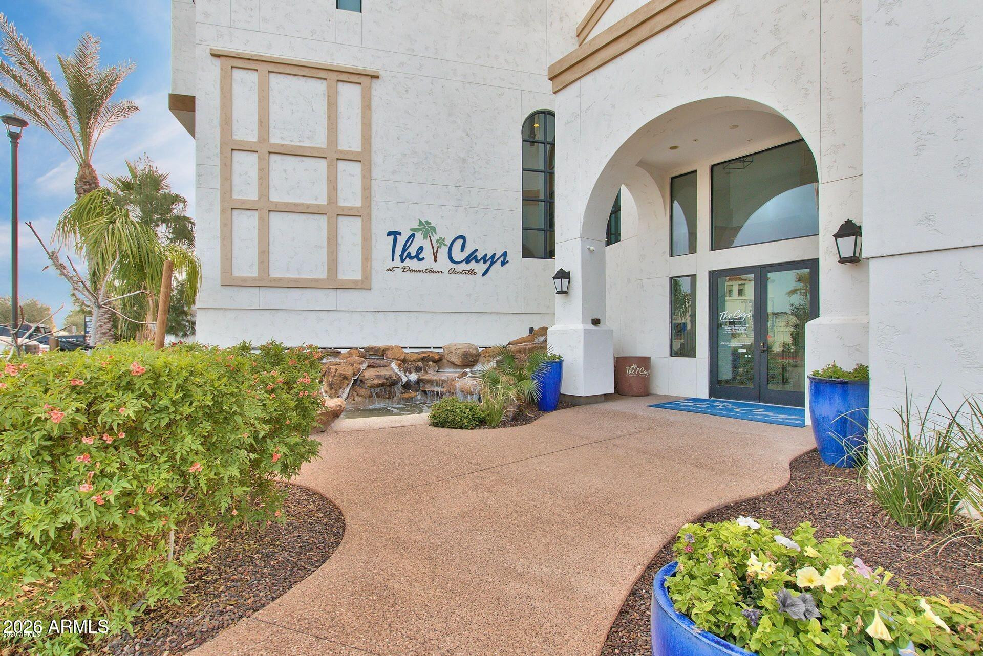 2511 West Queen Creek Road, Unit 438 Chandler, AZ 85248 - Photo 20 of 23 a front view of a house with garden