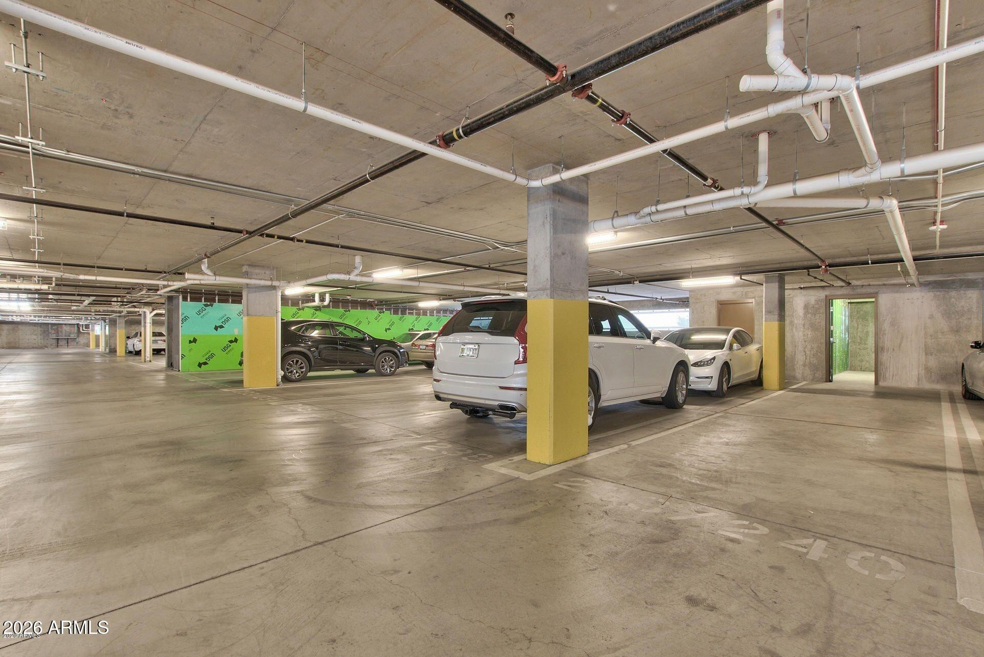 2511 West Queen Creek Road, Unit 438 Chandler, AZ 85248 - Photo 22 of 23 a view of a garage