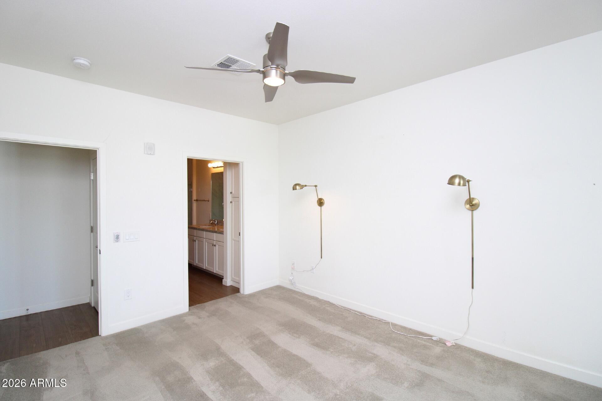 2511 West Queen Creek Road, Unit 438 Chandler, AZ 85248 - Photo 6 of 23 a view of a room with a ceiling fan