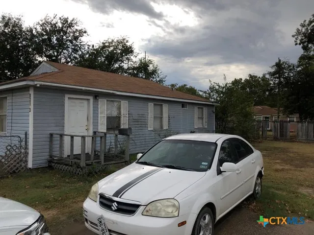 a car parked in front of a house