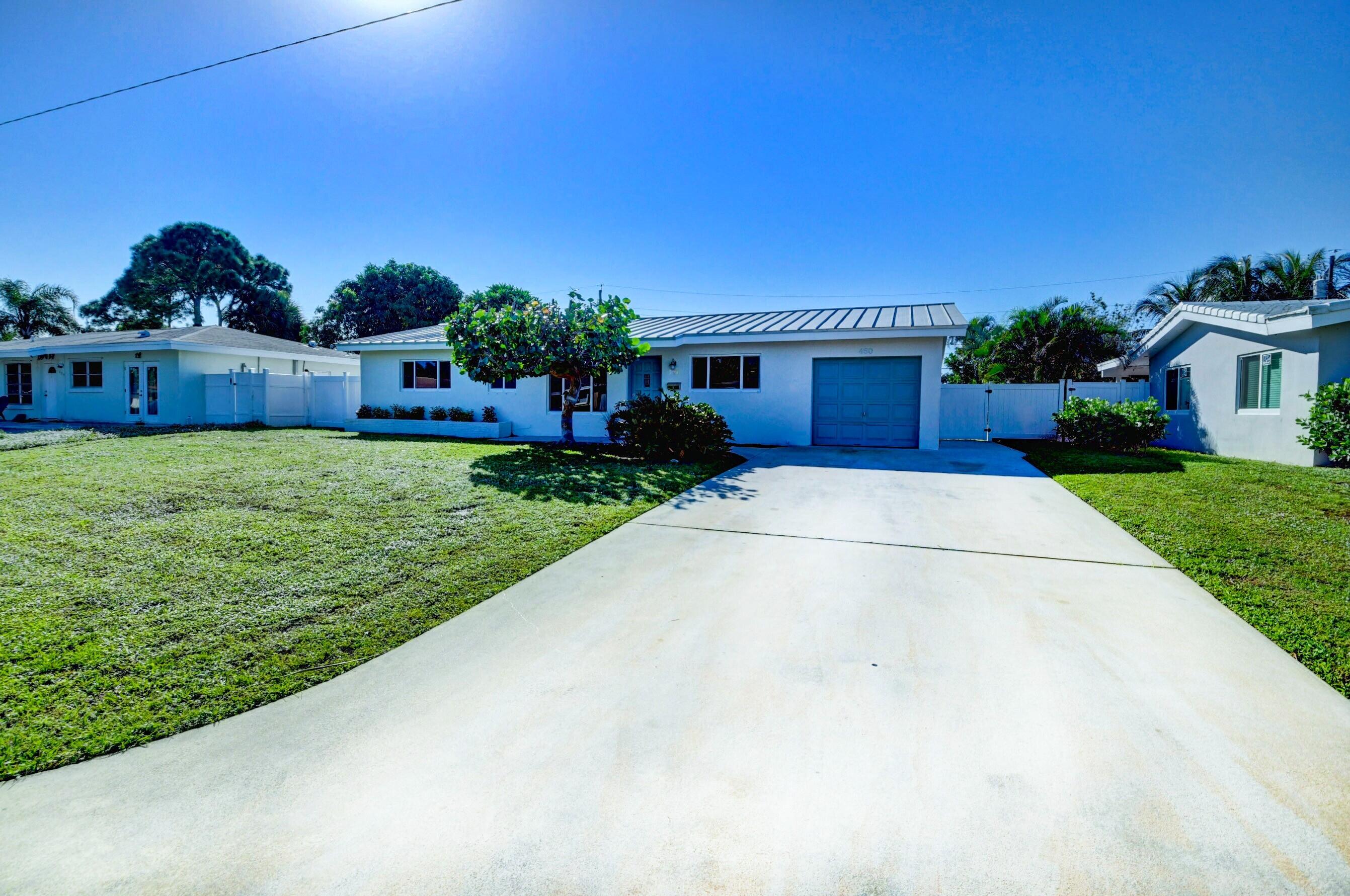 450 Northeast 33rd Street Boca Raton, FL 33431 - Photo 2 of 15 Extra wide driveway