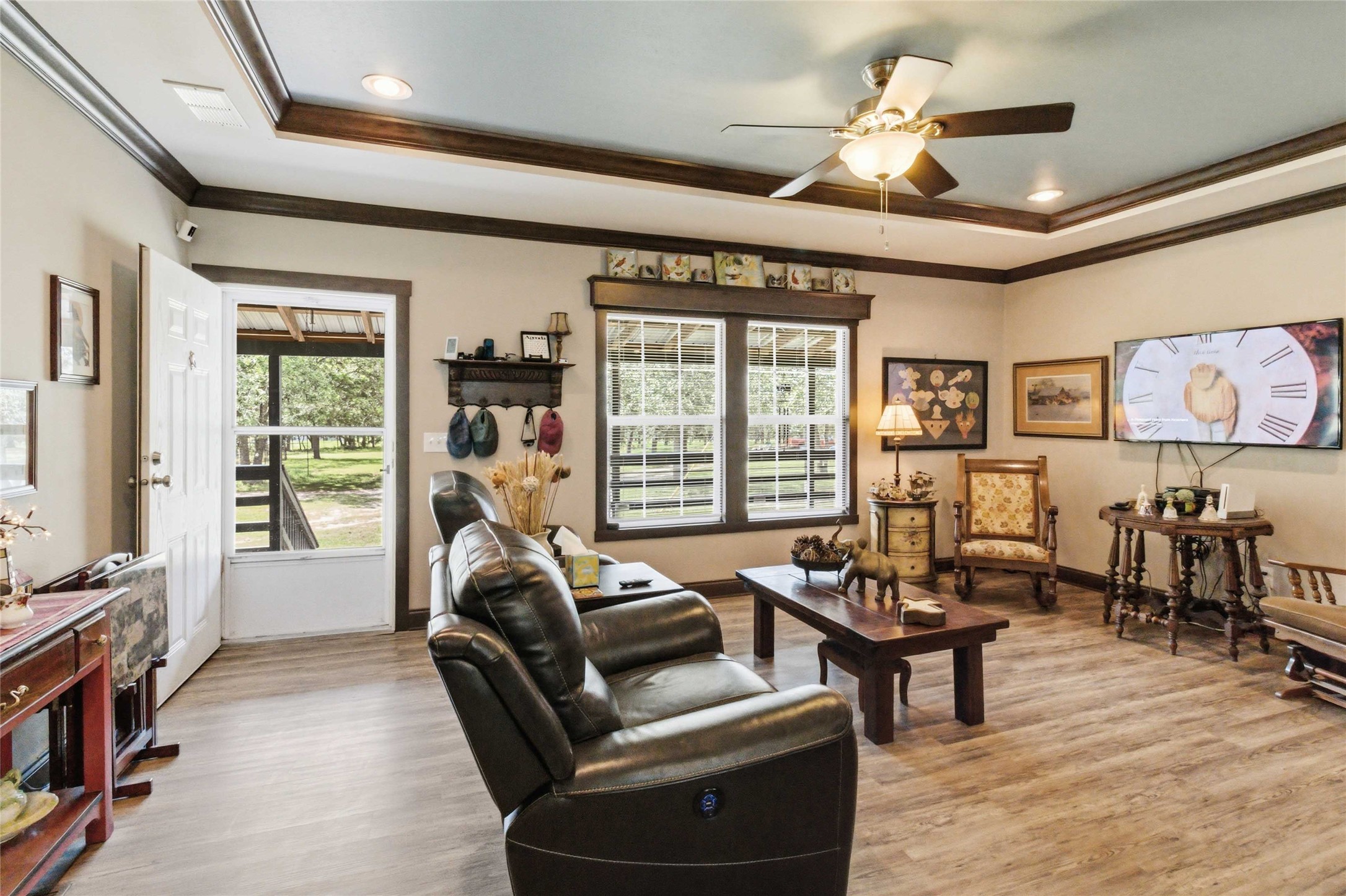 7921 Vista Ranch Road Smithville, TX 78957 - Photo 6 of 39 A comfortable living space featuring rich wood trim and recessed lighting for a warm ambiance.