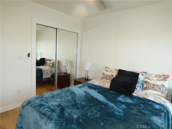 a bedroom with a bed and a walk in closet