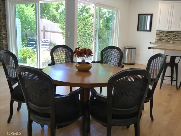 a view of a dining room with furniture and window