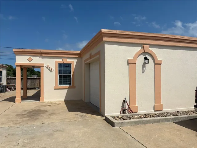 a front view of a house with a garage