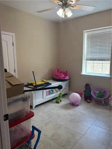 a living room with furniture and window