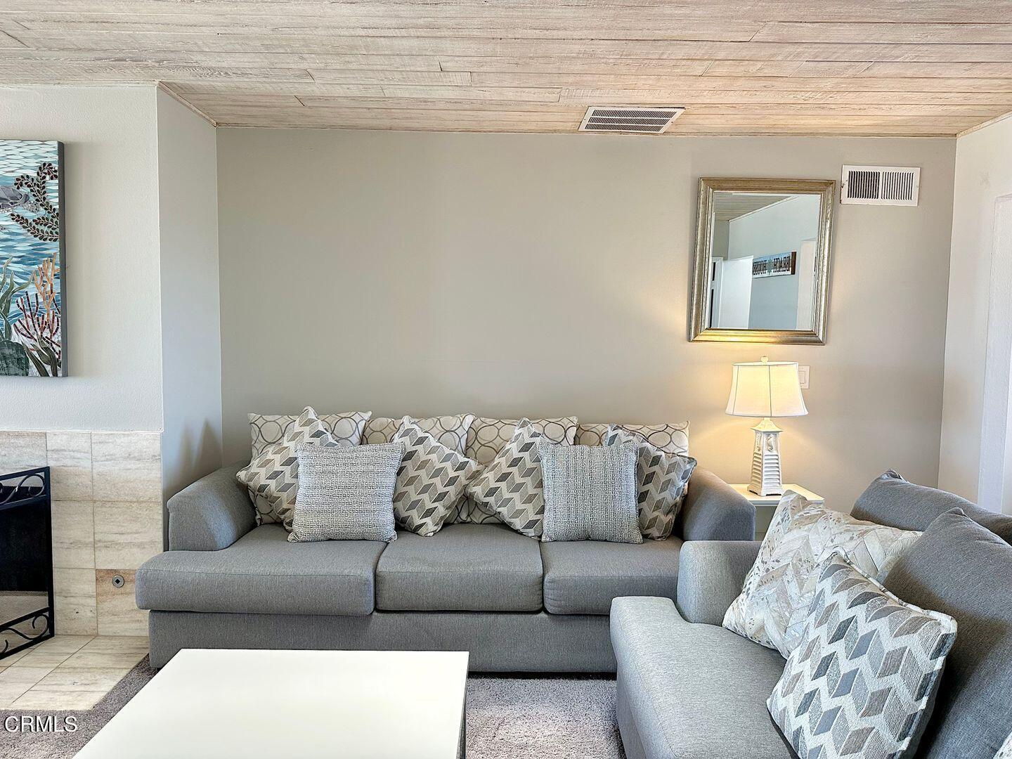 1364 Neptune Square Oxnard, CA 93035 - Photo 11 of 42 a living room with furniture and a couch