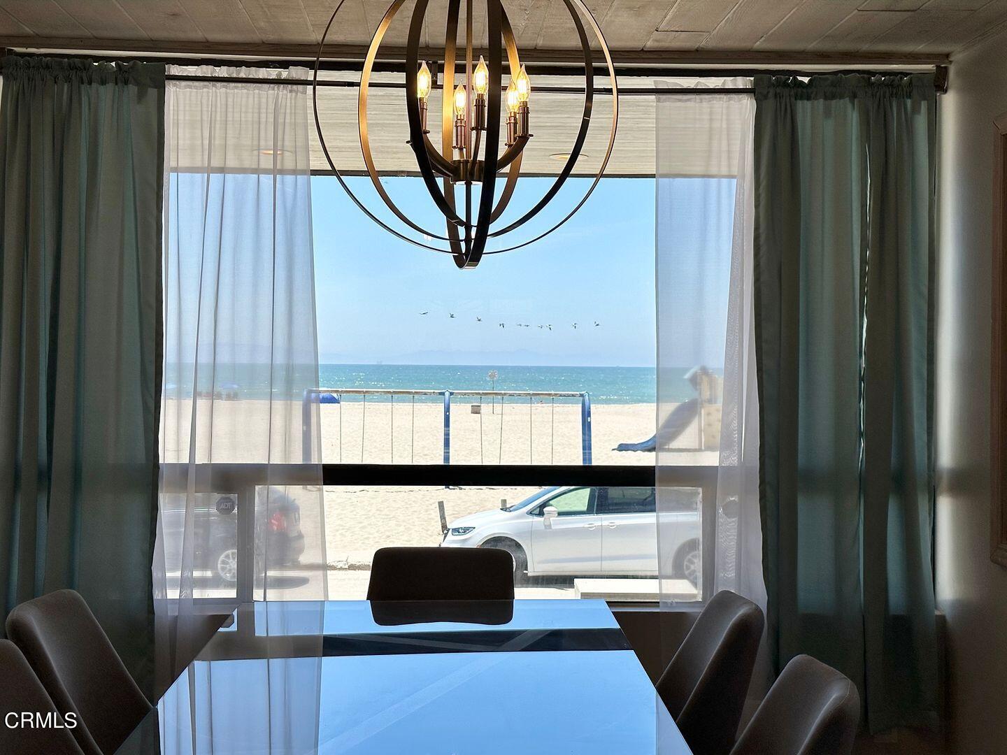 1364 Neptune Square Oxnard, CA 93035 - Photo 15 of 42 a living room with a couch and a table