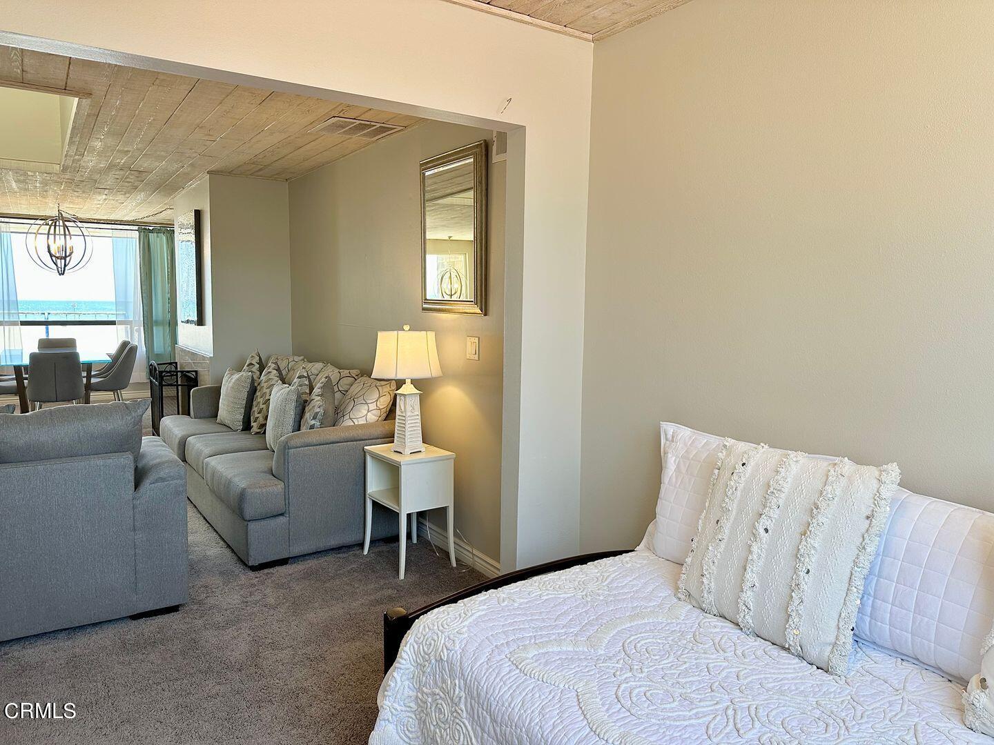 1364 Neptune Square Oxnard, CA 93035 - Photo 22 of 42 a bedroom with a bed and a couch