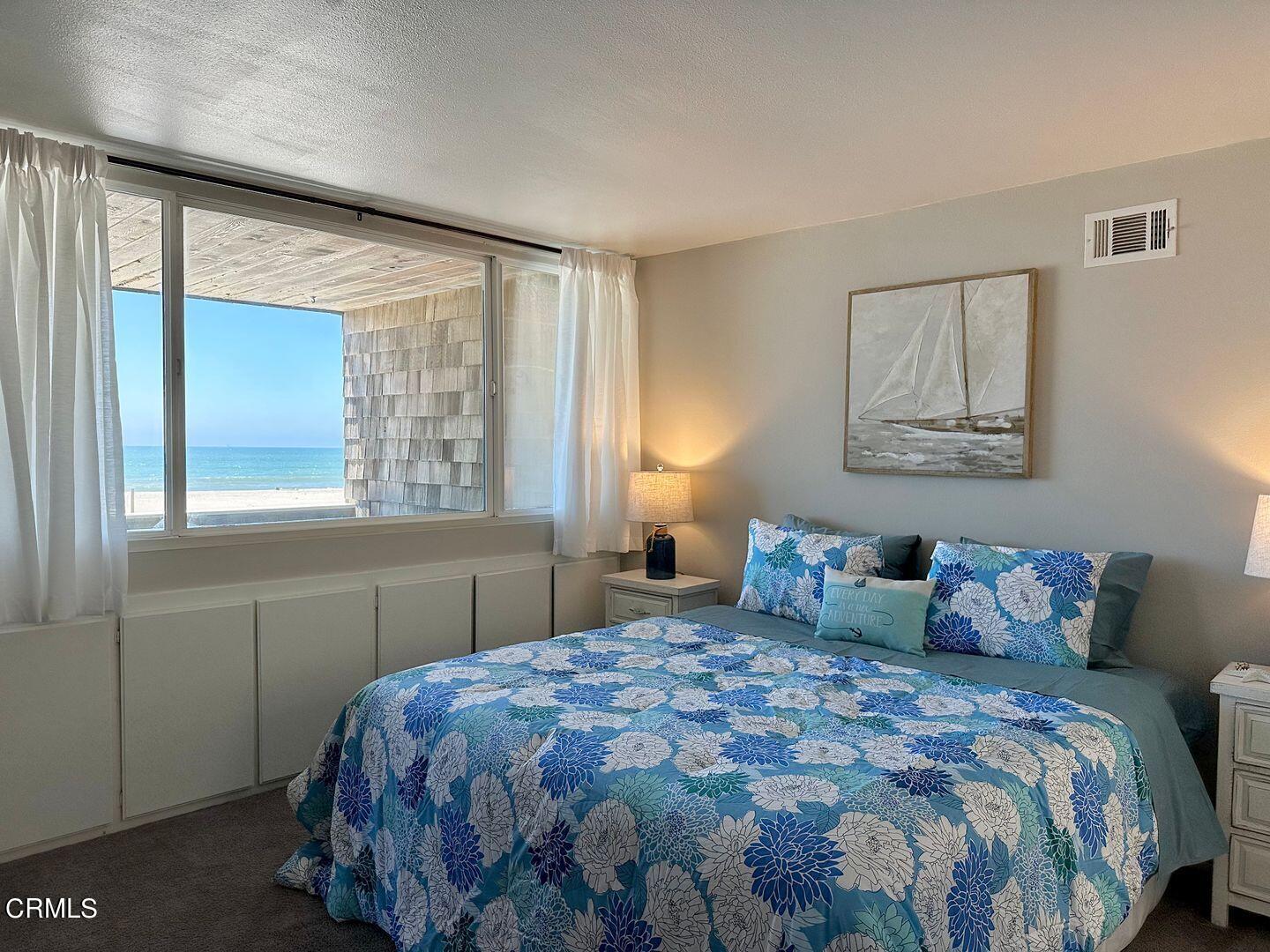 1364 Neptune Square Oxnard, CA 93035 - Photo 25 of 42 a bedroom with a large bed and a window