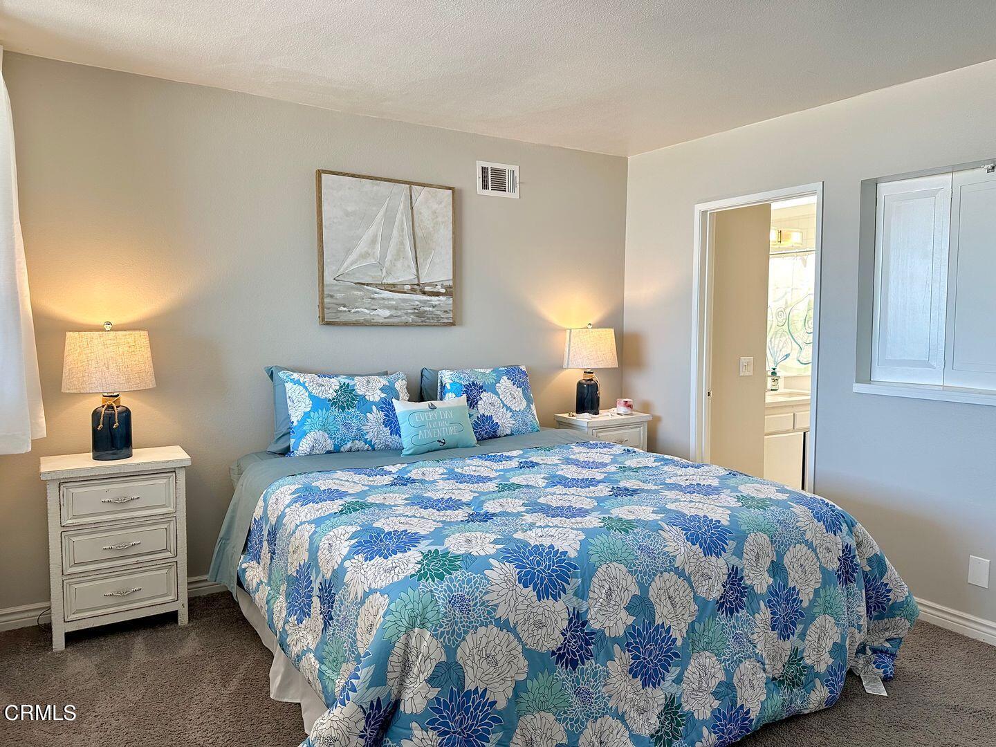 1364 Neptune Square Oxnard, CA 93035 - Photo 26 of 42 a bedroom with a bed and painting on the wall