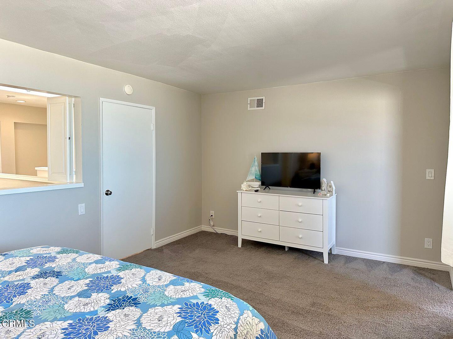 1364 Neptune Square Oxnard, CA 93035 - Photo 28 of 42 a bedroom with a bed and a couch