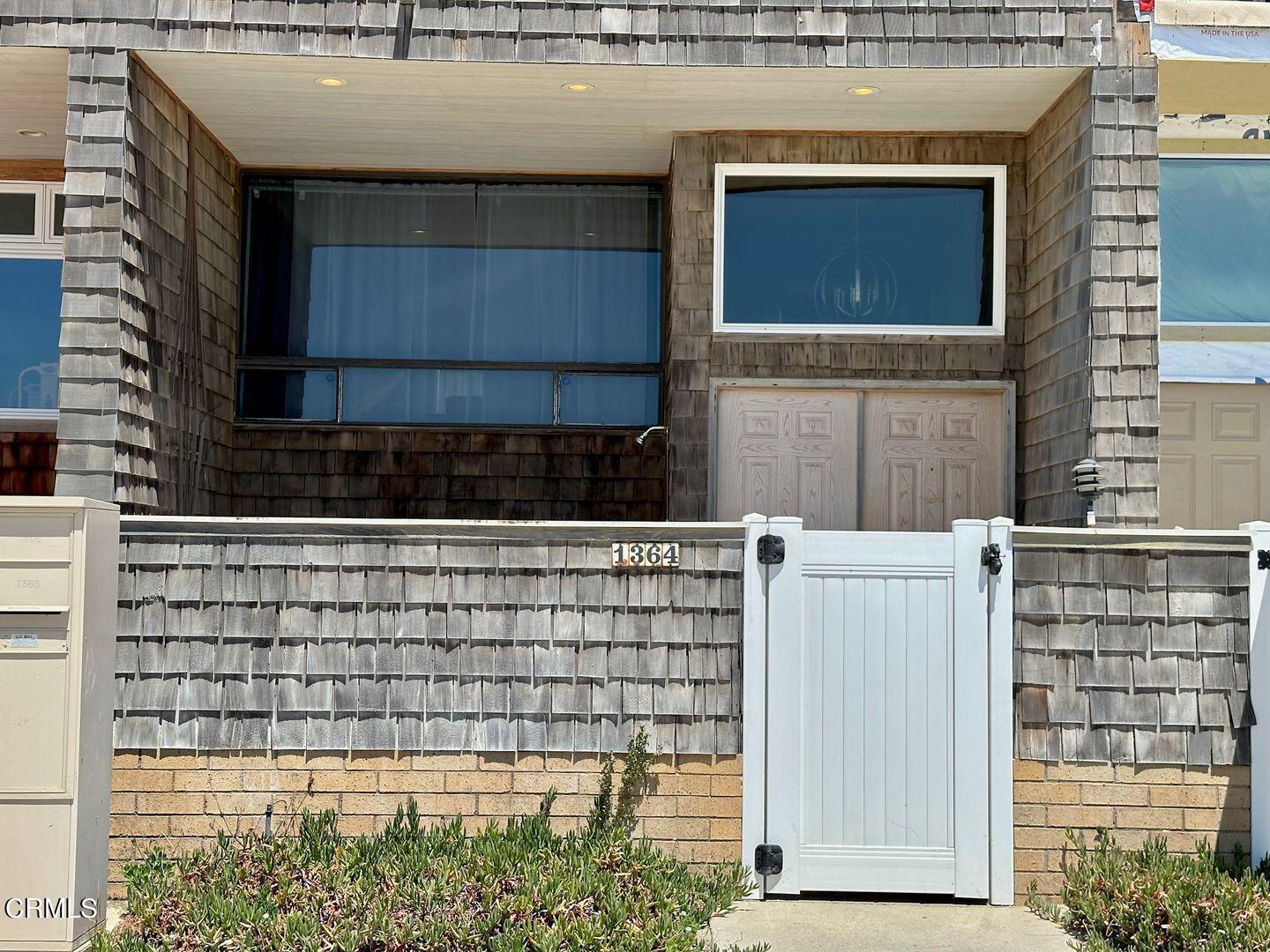 1364 Neptune Square Oxnard, CA 93035 - Photo 3 of 42 a front view of a house with a window