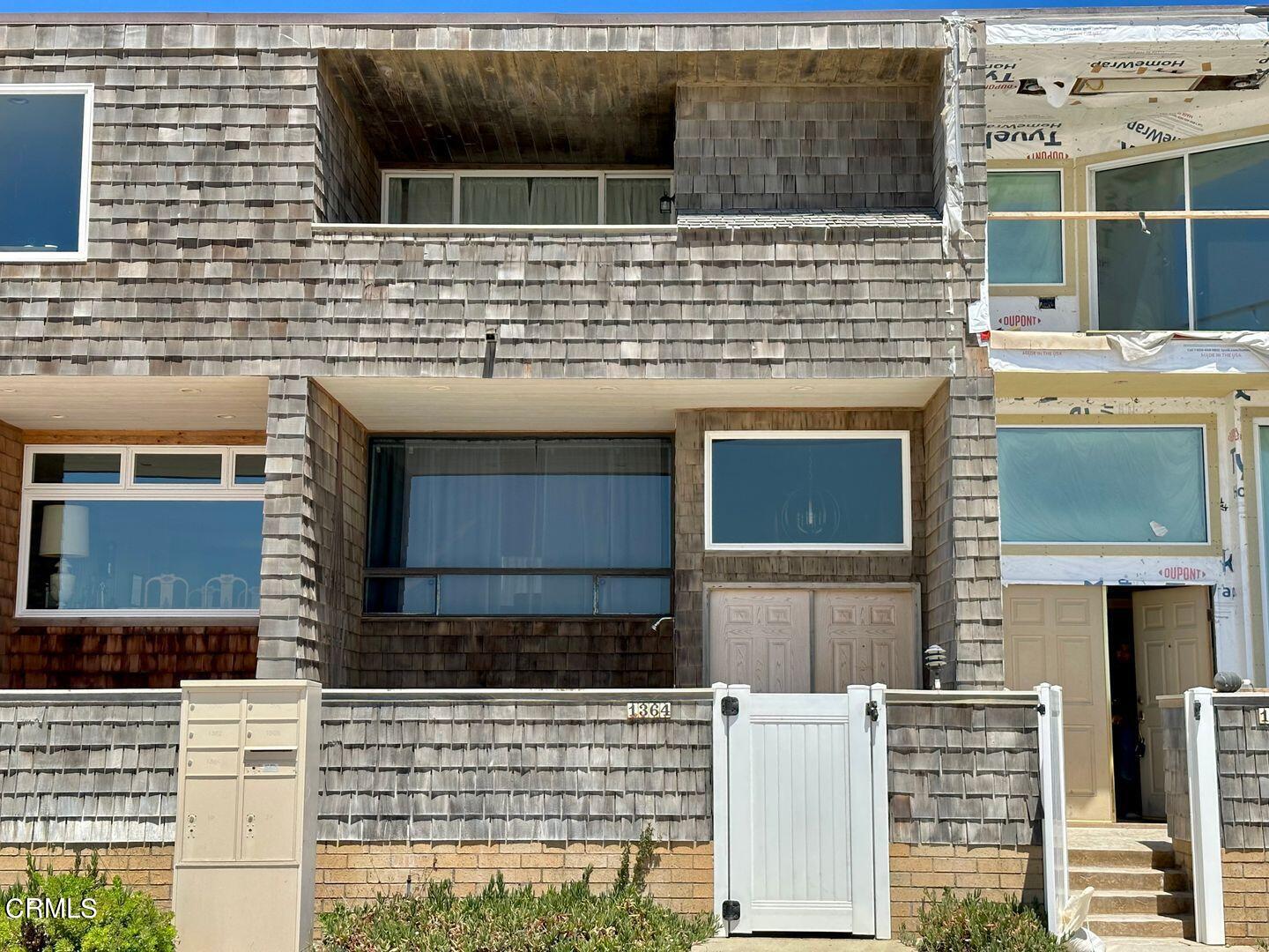 1364 Neptune Square Oxnard, CA 93035 - Photo 39 of 42 a view of kitchen with granite countertop white cabinets and black appliances