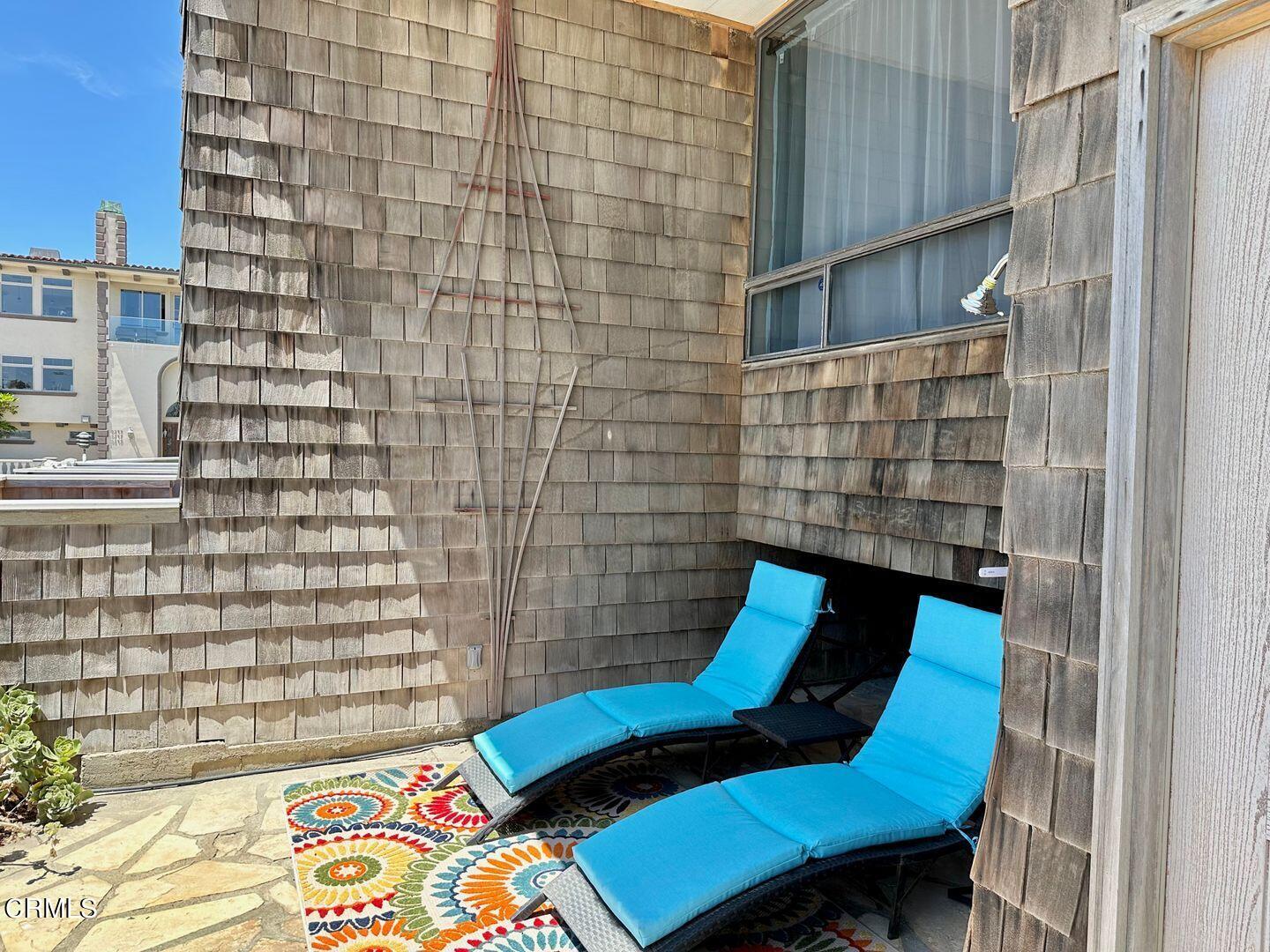 1364 Neptune Square Oxnard, CA 93035 - Photo 5 of 42 a balcony with a bench and a potted plant