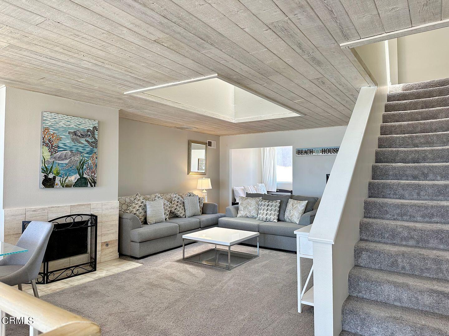 1364 Neptune Square Oxnard, CA 93035 - Photo 7 of 42 a living room with furniture and a fireplace