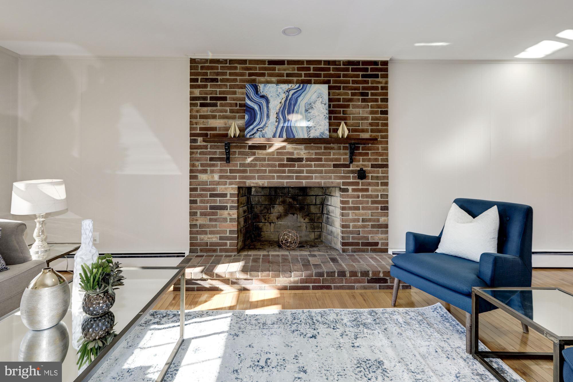 720 East Randolph Road Silver Spring, MD 20904 - Photo 12 of 31 Family Room Features Wood Burning Brick Fireplace