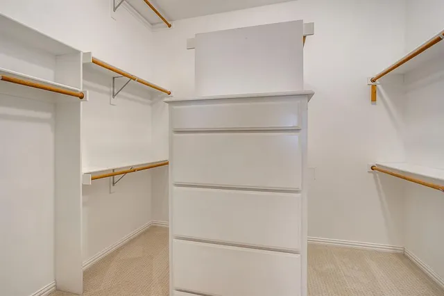 a view of an empty walk in closet