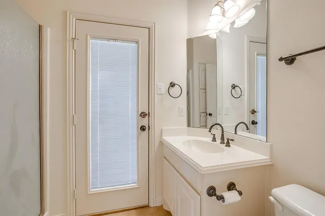 a bathroom with a sink a mirror and a shower