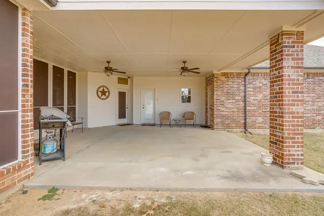 a view of a livingroom with furniture and a window