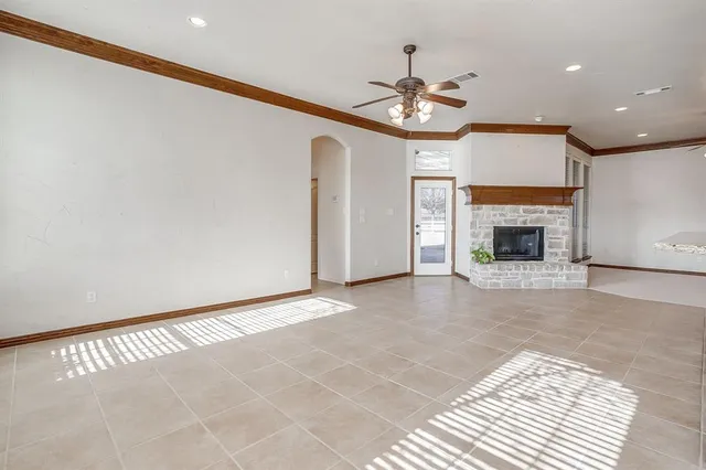 a view of an empty room with a fireplace