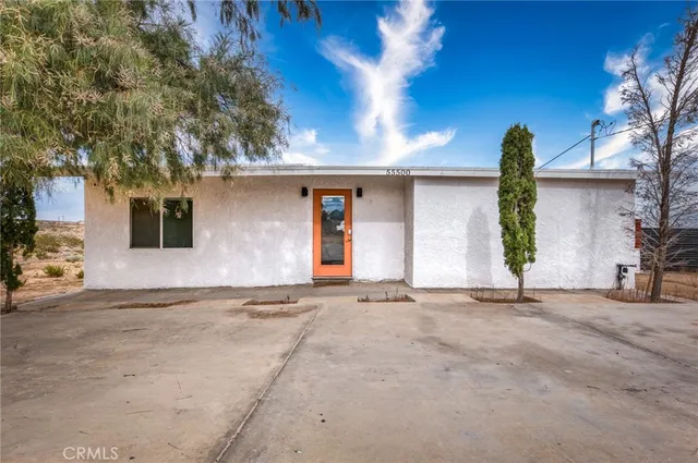 a view of a house with a yard and garage