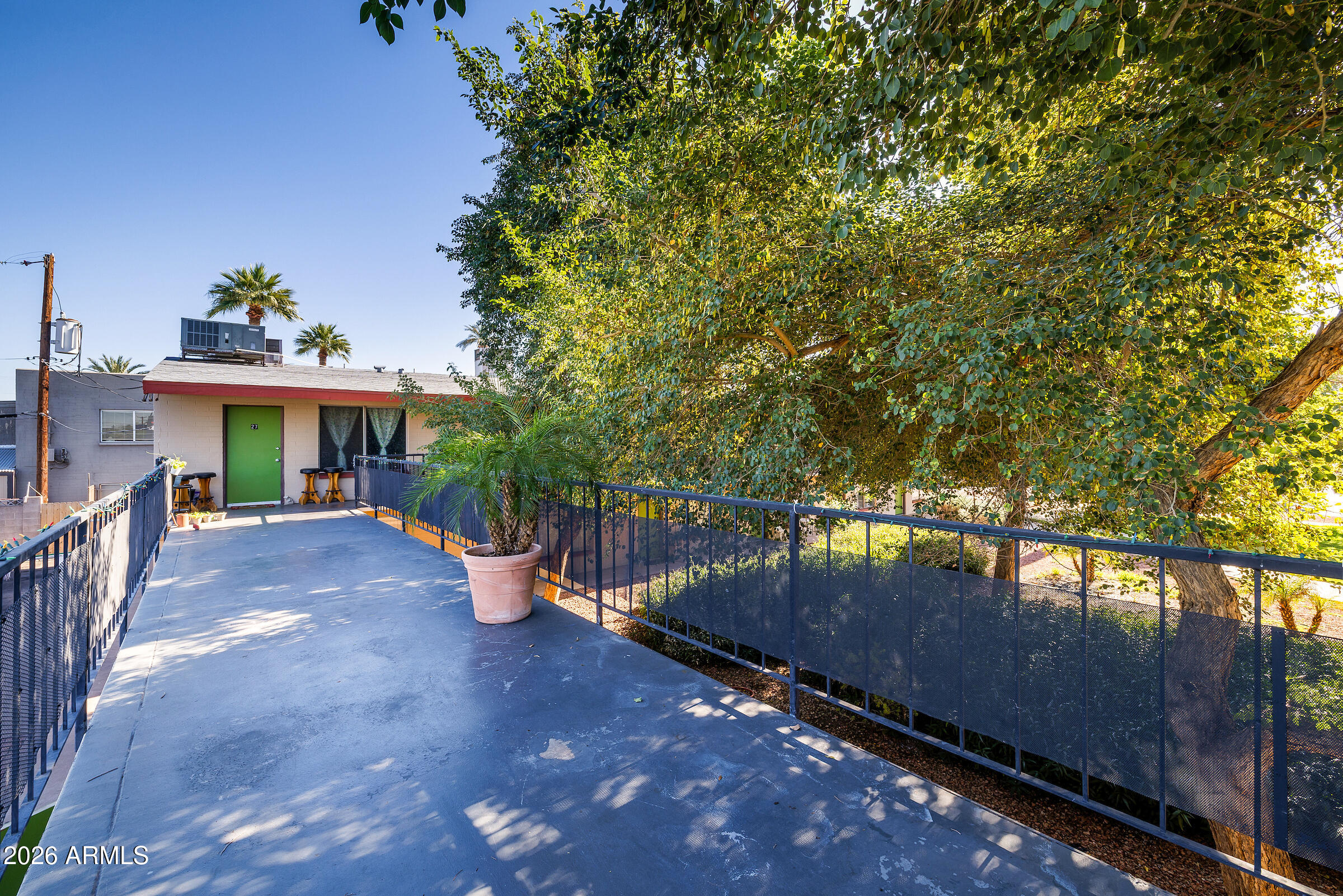 740 East Portland Street Phoenix, AZ 85006 - Photo 13 of 24 a view of a patio with chairs next to a yard