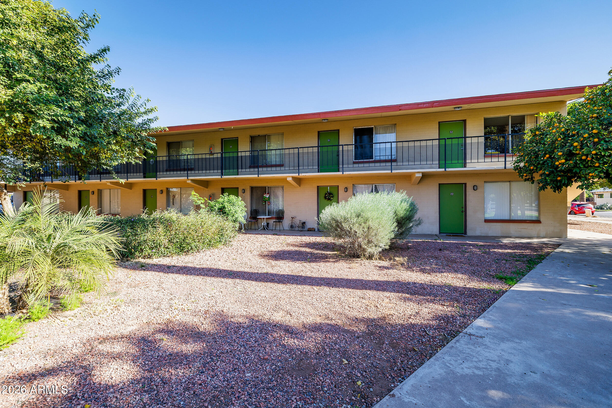 740 East Portland Street Phoenix, AZ 85006 - Photo 19 of 24 a front view of a house with garden