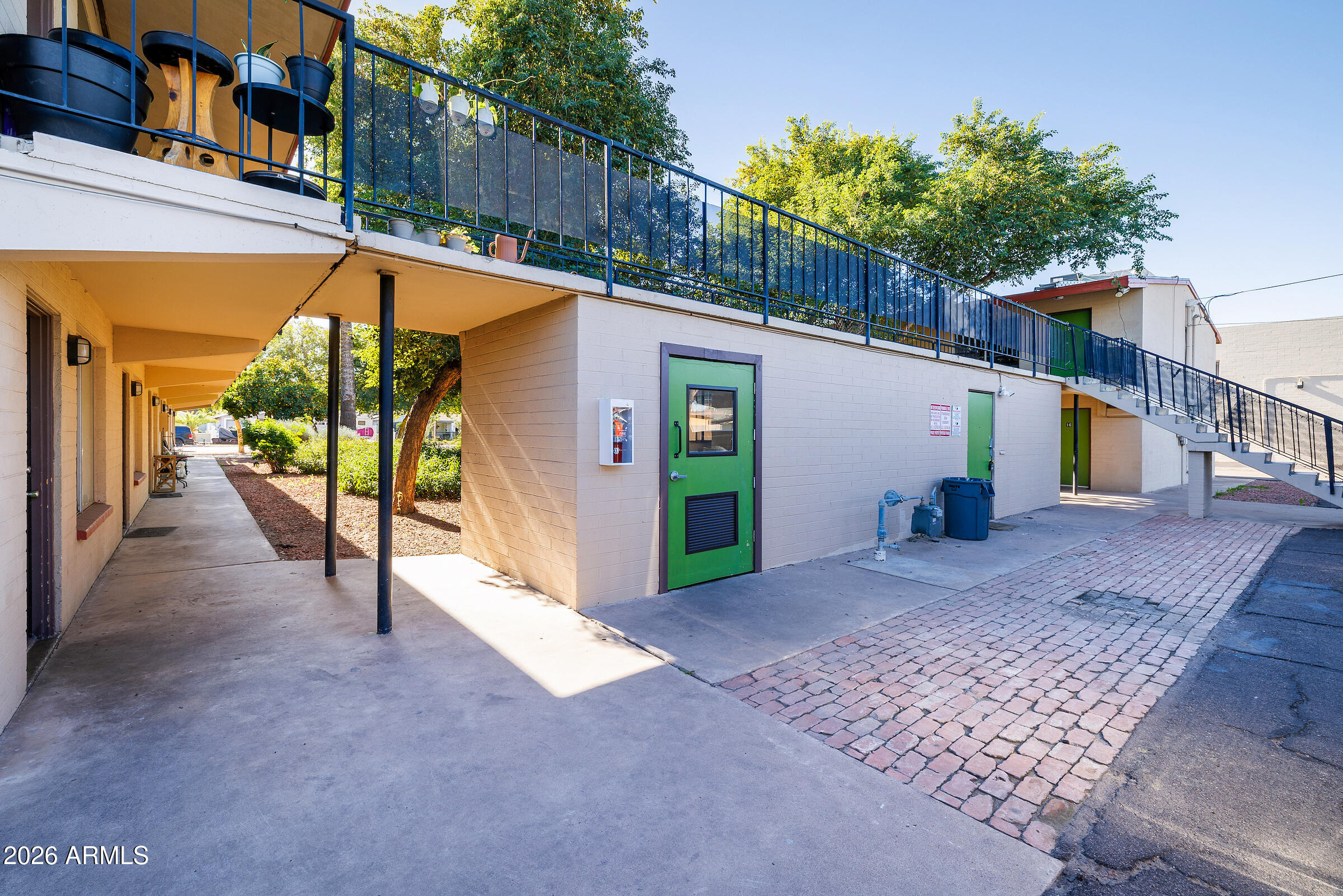 740 East Portland Street Phoenix, AZ 85006 - Photo 9 of 24 a view of a house with a yard and potted plants