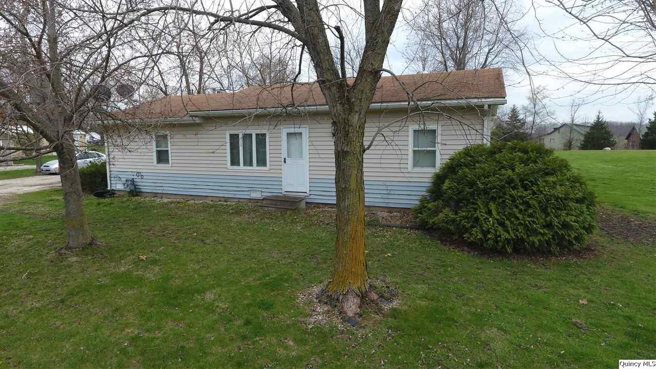 407 North Cherry Ewing, MO 63440 - Photo 1 of 1 a front view of house with yard and green space