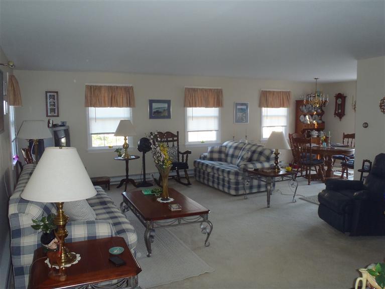 101 Depot Road, Unit 3/C Chatham, MA 02633 - Photo 1 of 13 a living room with furniture and a table