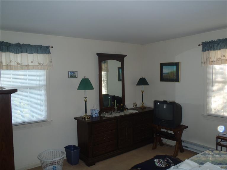 101 Depot Road, Unit 3/C Chatham, MA 02633 - Photo 11 of 13 a living room with furniture and a mirror
