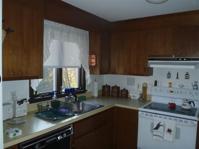 101 Depot Road, Unit 3/C Chatham, MA 02633 - Photo 12 of 13 a kitchen with a sink and cabinets