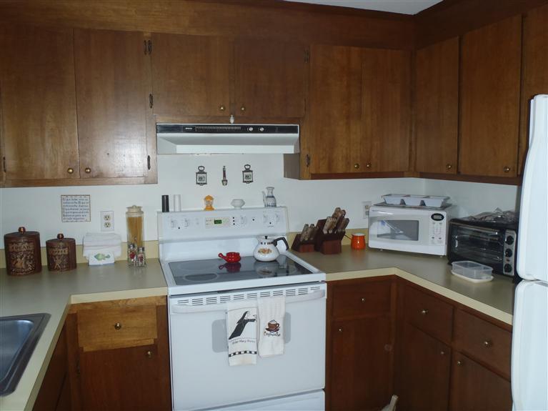 101 Depot Road, Unit 3/C Chatham, MA 02633 - Photo 13 of 13 a kitchen with a stove and cabinets