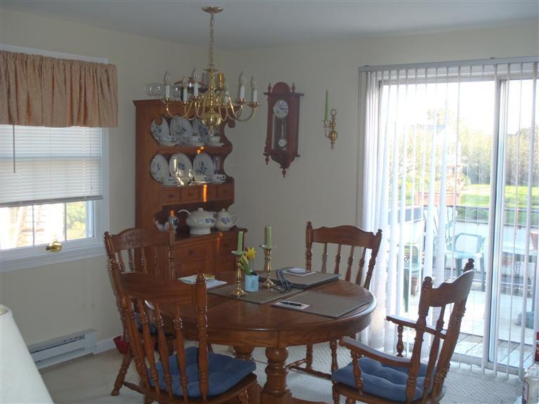 101 Depot Road, Unit 3/C Chatham, MA 02633 - Photo 3 of 13 a view of a dining room with furniture window and outside view