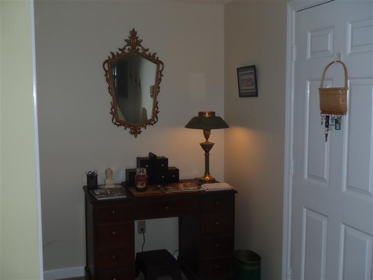 101 Depot Road, Unit 3/C Chatham, MA 02633 - Photo 6 of 13 a room with a table and a mirror