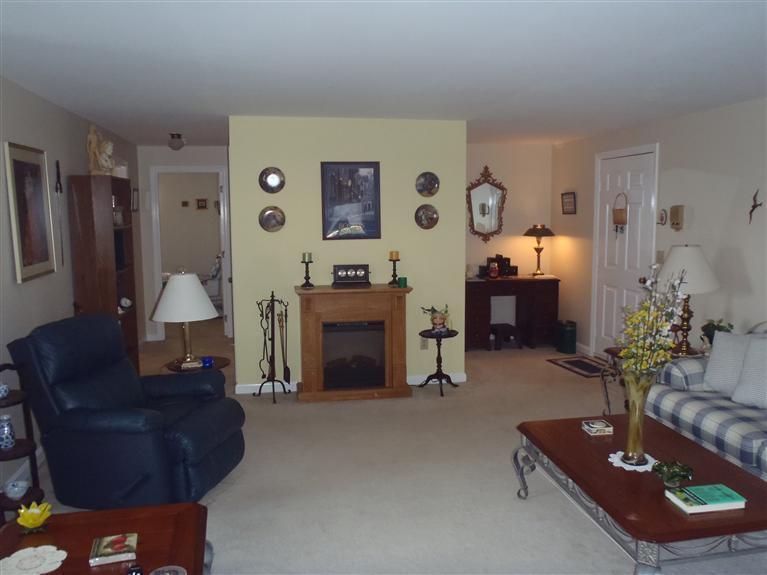 101 Depot Road, Unit 3/C Chatham, MA 02633 - Photo 8 of 13 a living room with furniture and a fireplace