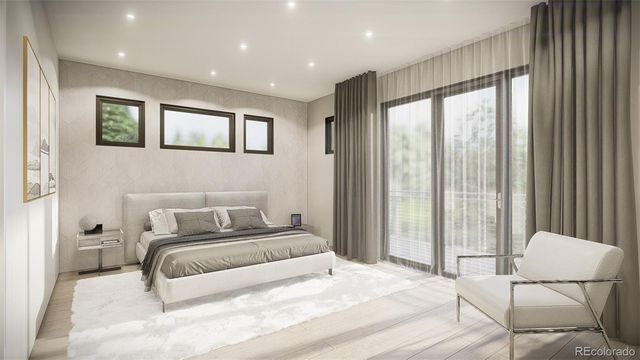 a bedroom with a large bed and a large window