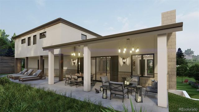 a view of a patio with table and chairs potted plants and a large tree