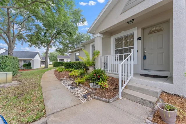 front view of a house with a yard