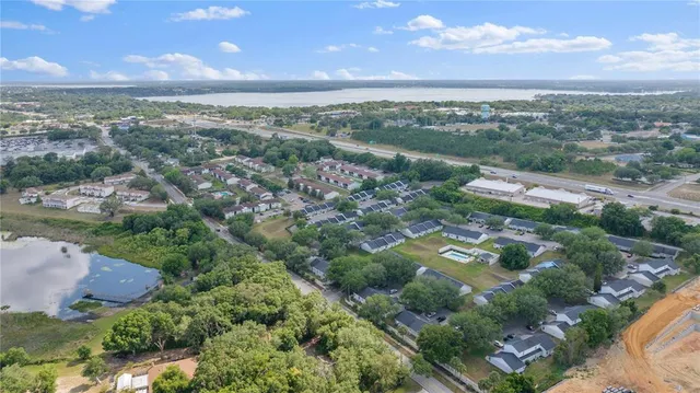 an aerial view of city and lake