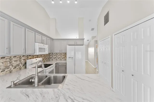 a kitchen with a sink and cabinets