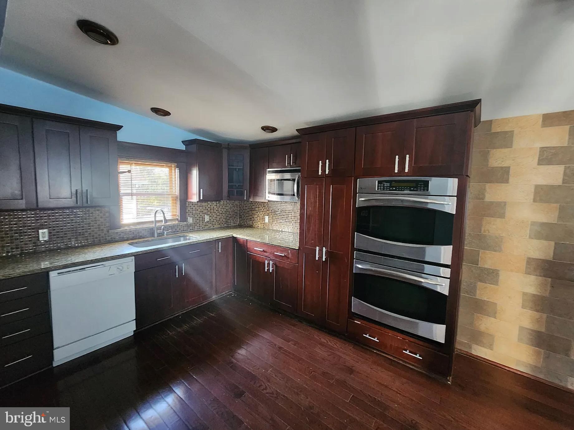 42 Tilbury Road Salem, NJ 08079 - Photo 2 of 10 Modern kitchen with rich wood accents.
