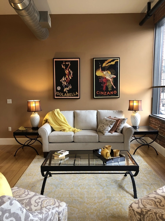 55 Green Street, Unit D184 Clinton, MA 01510 - Photo 2 of 18 a living room with furniture