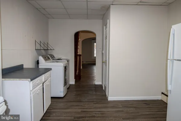 a kitchen with a refrigerator and sink