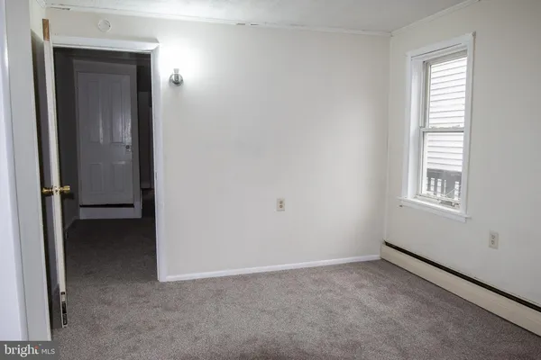 a view of an empty room and window
