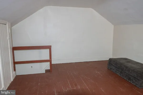 a living room with furniture and a chair