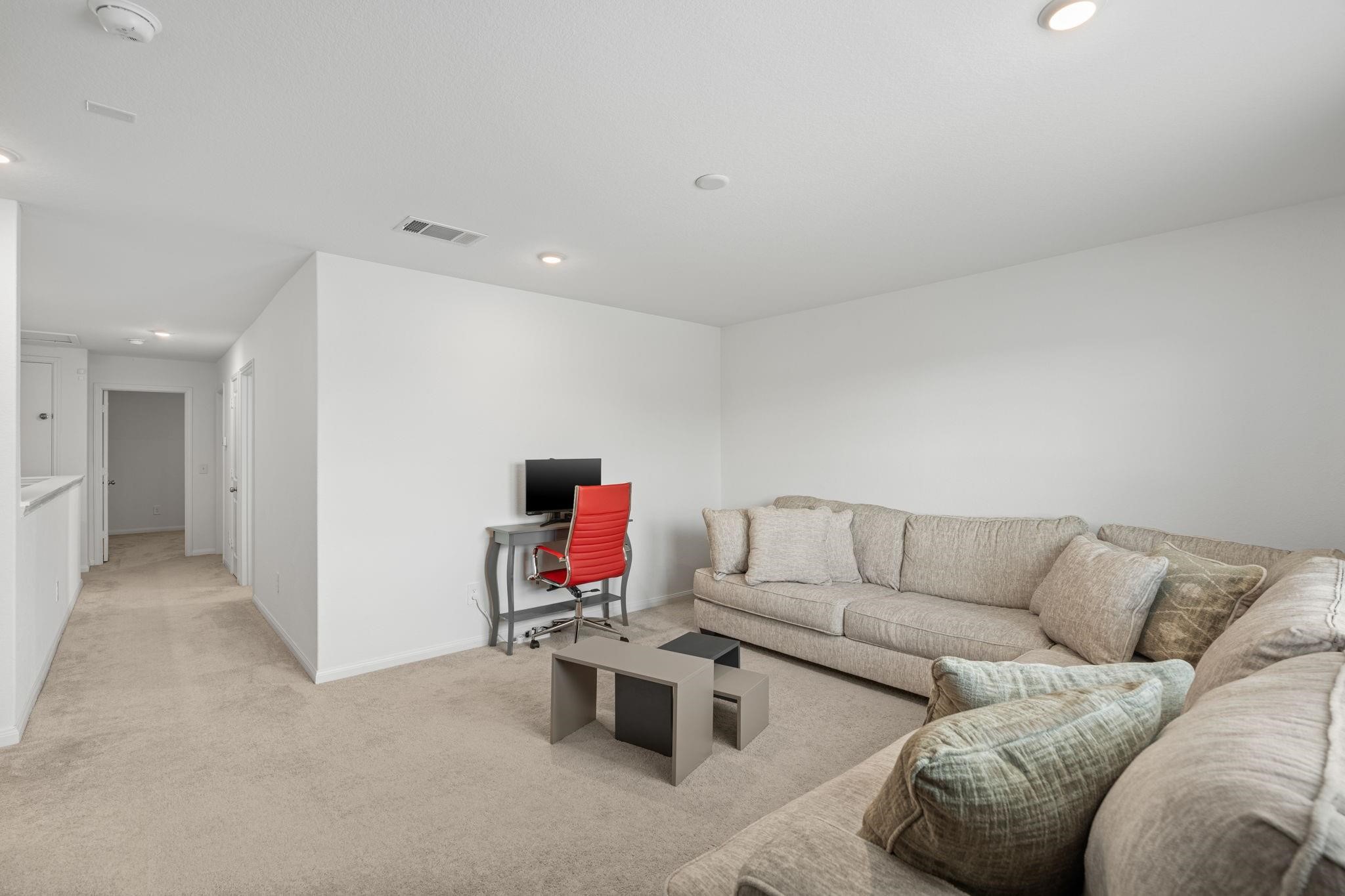 23543 Powmill Street Spring, TX 77373 - Photo 20 of 32 a living room with furniture and a couch
