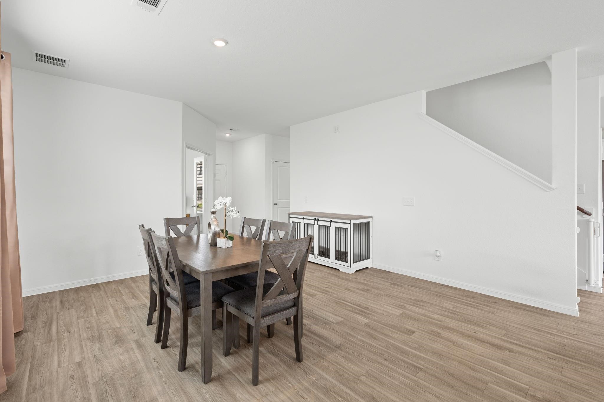 23543 Powmill Street Spring, TX 77373 - Photo 9 of 32 a view of a dining room with furniture and wooden floor